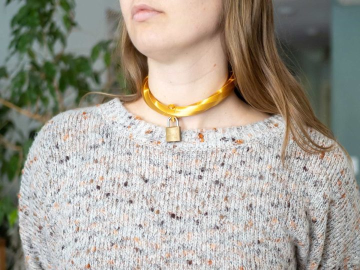 Woman wearing golden collar