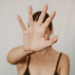 Woman holding up hand