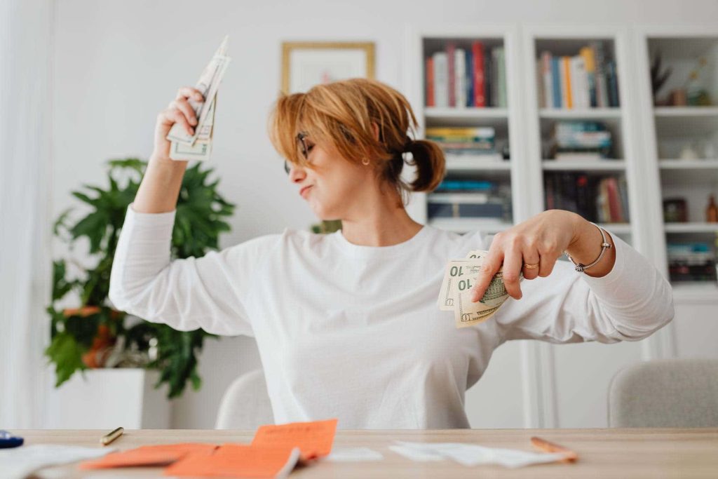 Woman with dollar bills in hands